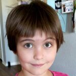 Woman pranks colleagues with fake bad haircut